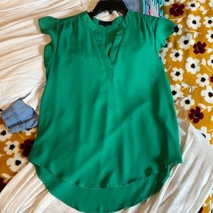 Green V-neck blouse